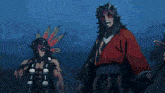 a man in a red kimono is standing next to a man with feathers on his head