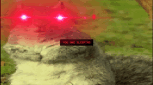 a pixelated image of a cat with red eyes and the words you are sleeping