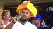 a man wearing a cheese hat and gloves