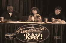 a woman says ' kay ' in front of a fox sign