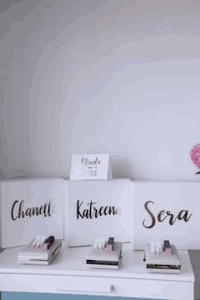 three white boxes with the names chanelle katreena and sera