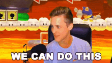 a man is sitting in front of a microphone with the words we can do this behind him