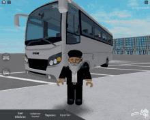 a man with a beard is standing in front of a bus that says otokar on the front