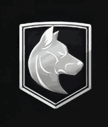 a silver emblem of a dog 's head in a shield on a black background