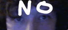 a close up of a person 's eyes with the word no written above them