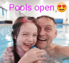 a man and a little girl in a swimming pool with the words pools open