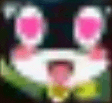 a blurred image of a cartoon character with pink eyes and a tongue sticking out .