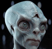 a close up of an alien 's face with big blue eyes