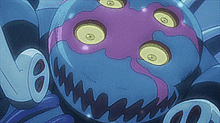 a cartoon drawing of a purple and blue monster with yellow eyes