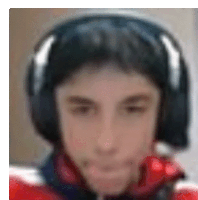 a blurry picture of a young man wearing headphones .