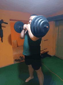 a man squatting with a barbell on his back