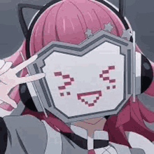 a girl with pink hair is wearing headphones and covering her face with a smiley face .