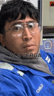 a man wearing glasses and a blue jacket says ala verga guiey