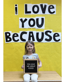 a little girl holds a sign that says " you give me great food "