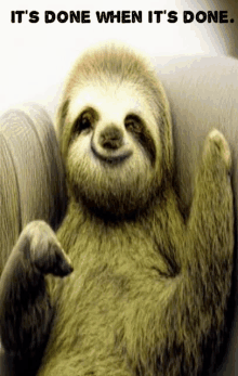 a smiling sloth is laying on a couch with the words it 's done when it 's done