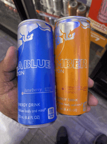 a blue and orange can of energy drinks