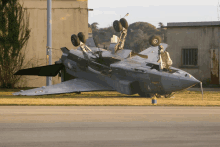 a damaged fighter jet with the letter c on the side