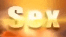 a blurred image of the word sex in white letters