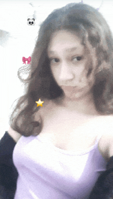 a girl in a purple tank top with a star on her shoulder