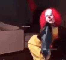 a clown with red hair is dancing in a room .