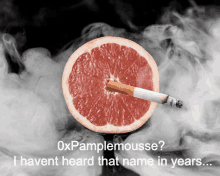 a grapefruit with a cigarette sticking out of it is surrounded by smoke