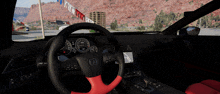 the inside of a car with a red steering wheel and a black dashboard