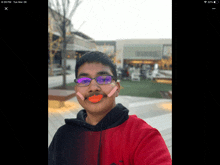 a boy wearing glasses and a fake mustache is taking a selfie on tuesday march 28th