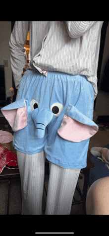 a person wearing a pair of shorts that look like elephants