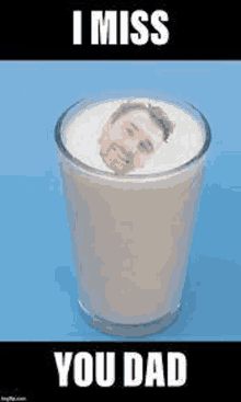 a glass of milk with a picture of a man in it .