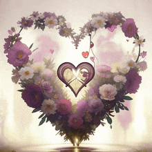 a heart shaped wreath of flowers with a purple heart in the center