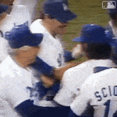 a group of baseball players are standing in a huddle and one of them is wearing a jersey with the number 1 on it .