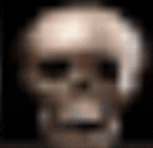 a blurry picture of a skull with a black background