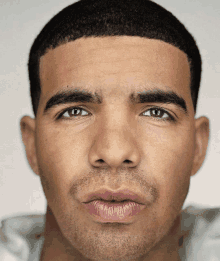 a close up of a man 's face with a beard and pink lips