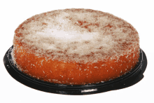 a cake with powdered sugar and coconut on top