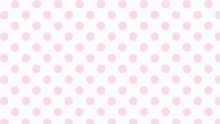 a pattern of pink polka dots on a white background