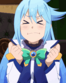 a girl with blue hair and a green bow is making a face with her eyes closed