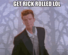 a man singing into a microphone with the words " get rick rolled lol " above him