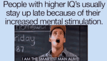 a man is standing in front of a blackboard with the words people with higher iq 's