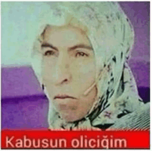 a woman wearing a head scarf and headphones has a caption that says kabusun olicigim