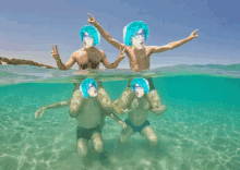 a group of men with blue hair and glasses are underwater