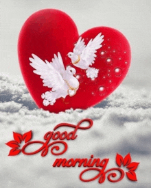 two white doves are flying around a red heart with the words `` good morning '' written below it .