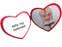 a red heart shaped mirror with the words felix my beloved written on it