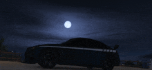 a car is parked under a full moon at night