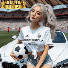 a woman holding a soccer ball in front of a car with the words museum bola on the top