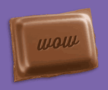 a piece of chocolate that says wow on it