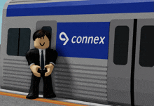 a cartoon character leaning against a train with the word connex on the side