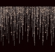 a string of icicle lights on a black background .