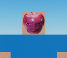 a red apple with a face on it