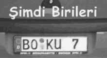 a black and white photo of a license plate that says boku 7