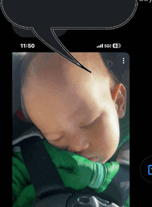 a phone screen shows a baby sleeping and a speech bubble with the time of 11:50